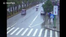 Minibus plummets into ditch after being hit by turning car in China