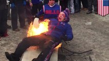 Buffalo Bills fan catches fire after jumping onto flaming table...twice
