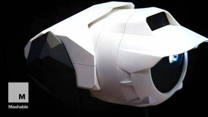 Transforming robot rolls around the home and projects screens wherever