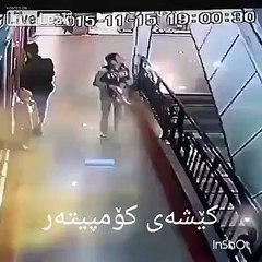 A teen boy saves a younger one falling from Escalator