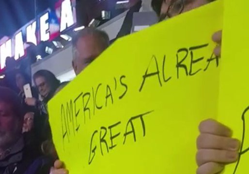 Trump Supporters Tear Up Protesters' Signs, Jeer as They Are Ejected From Rally