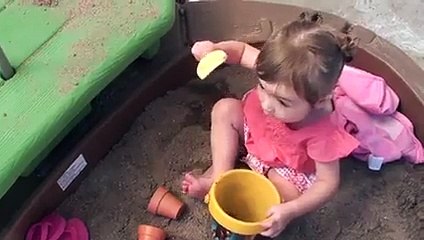 baby doesnt like sand on herself