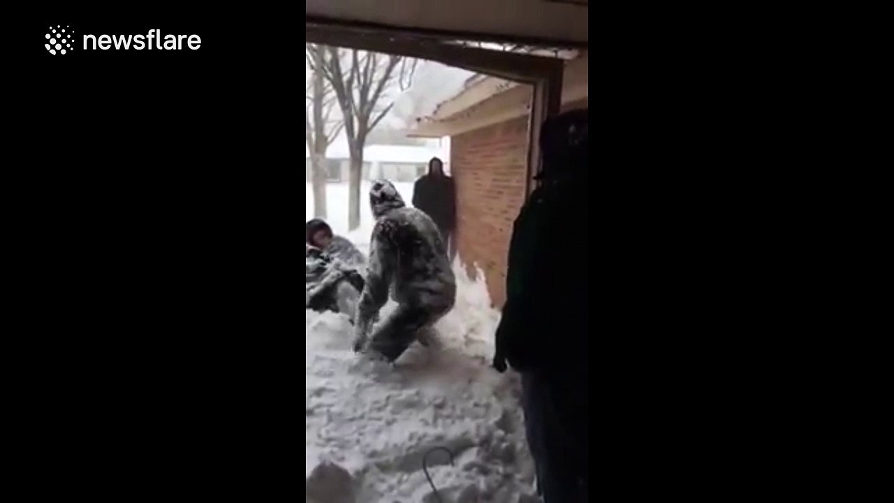 Moment kids buried under snow from rooftop