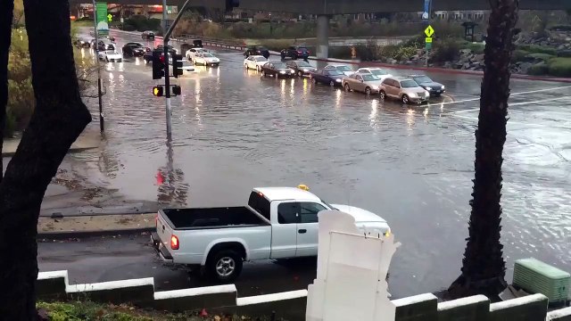 Lamborghini driving through San Diego flood