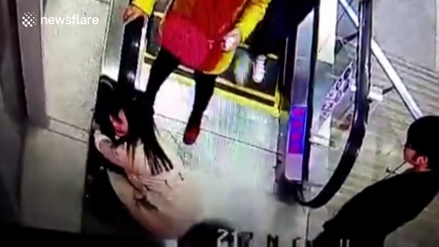 Boy just rescued in time after his head got trapped under escalator handrail