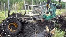 Timberjack 810D saving itself from the deep mud hole, extreme conditions