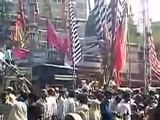 Colourful flags are rising in the crowd of the muslim festival MAHARAM