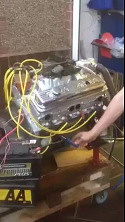 V8 boat engine running on a table