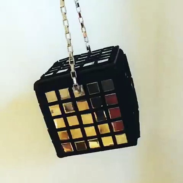 Embellished with 150 square mirrors, the black...