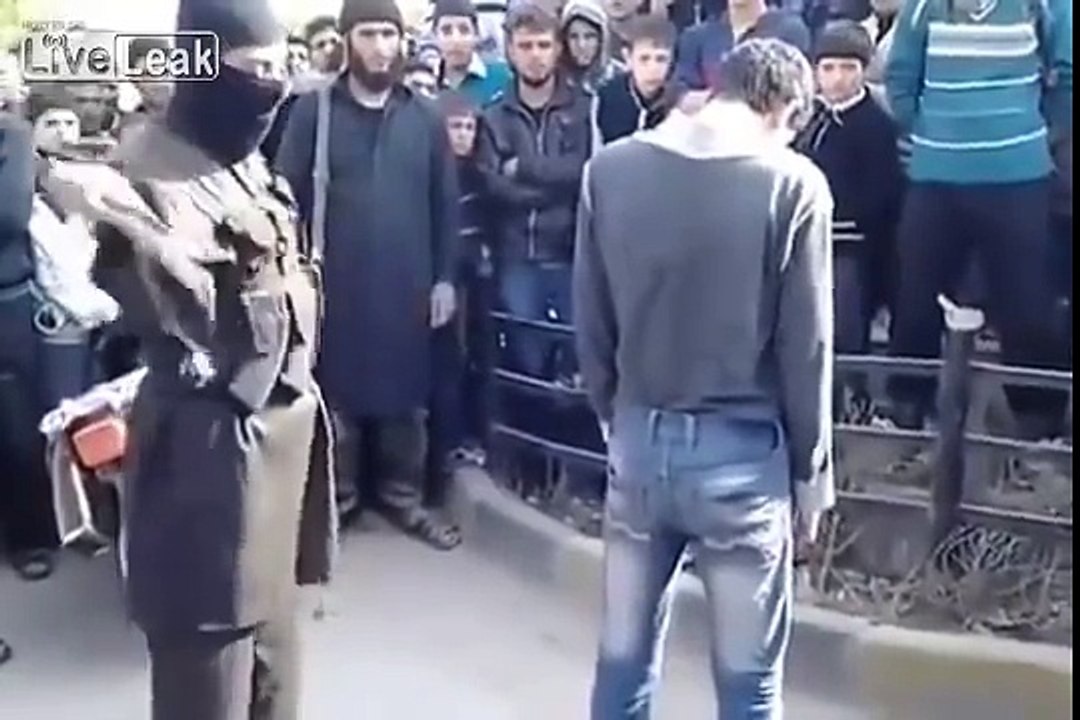 Sharia at work! 100 lashes for an adulterer! After his punishment he hugs his ISIL torturer!