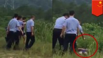 Chinese police caught on video executing man with shots to the head in an open field