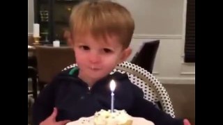 Lovely kid. Let us to help him turn off birthday candle.