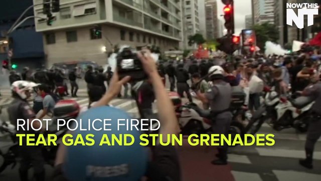 Riot Police Fires Stun Grenades At Peaceful Protesters In Brazil