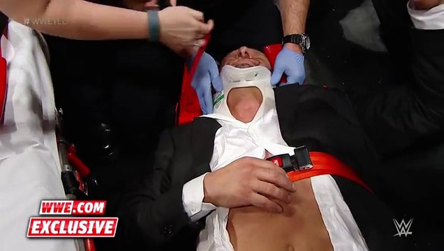 Triple H helped by paramedics after being attacked by Roman Reigns Dec. 13, 2015