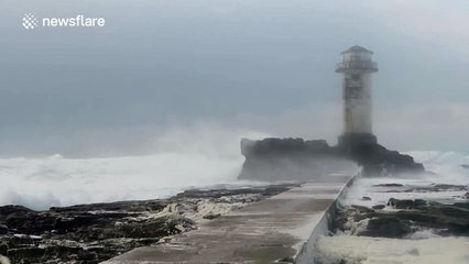 Stormy seas batter lighthouse in France