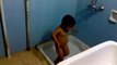 Small Naked Baby Boy Is Enjoying His Bath
