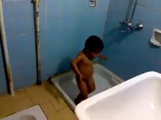 Small Naked Baby Boy Is Enjoying His Bath