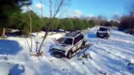 Lada Niva with snow during the day and night..