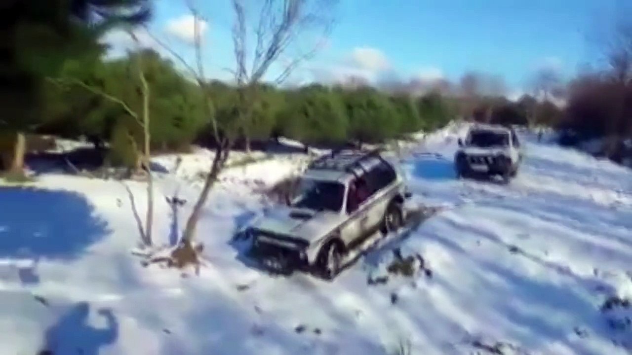 Lada Niva with snow during the day and night..