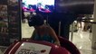 Woman tests Roller Coaster on occulus rift at a shopping mall