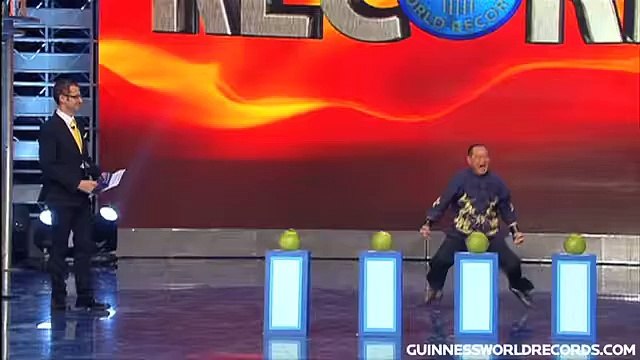 Fastest time to pierce 4 coconuts with 1 FINGER! - Guinness World Records Classics -