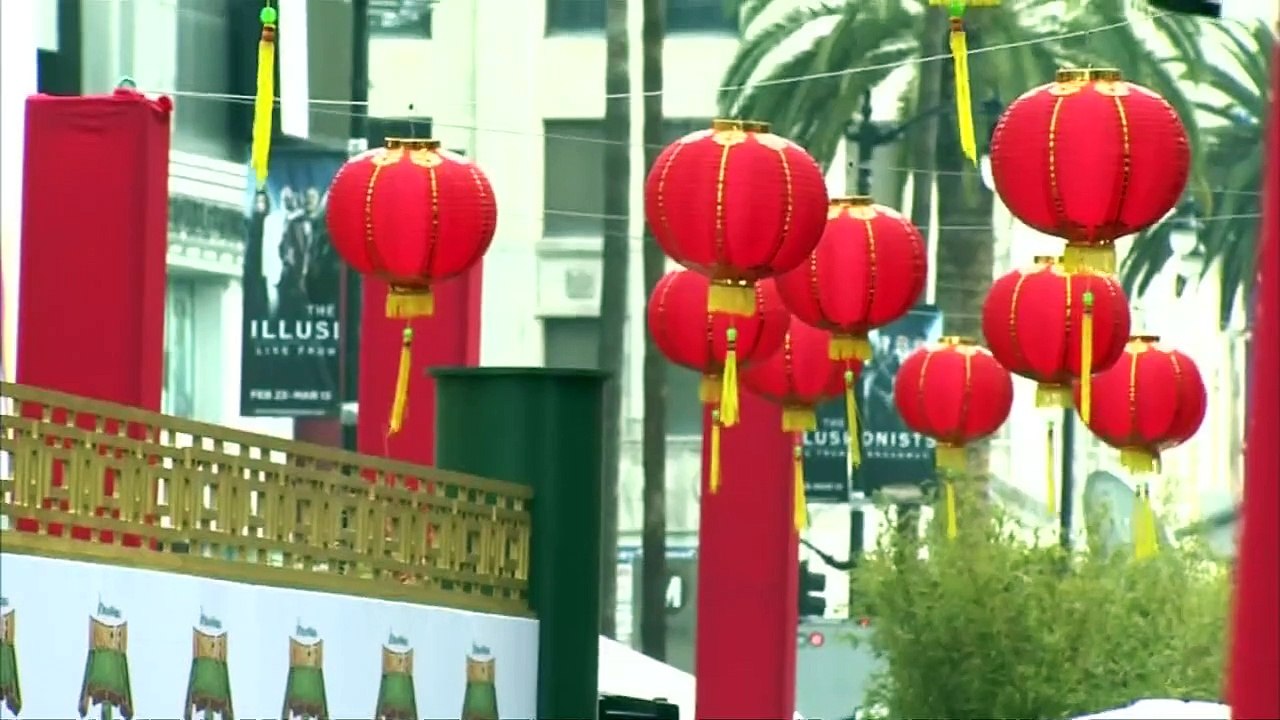Angelina Jolie smooches Jack Black at Panda Premiere