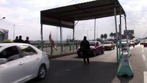 Iraqi forces search cars at Baghdad checkpoint after kidnapping