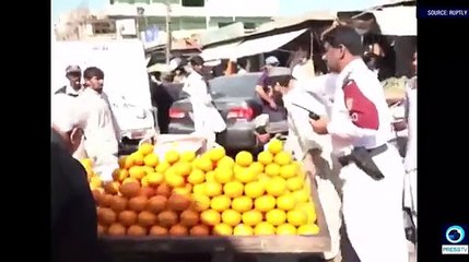 An angry police officer fed up of illegal stalls set up around Karachi, goes on a rampage