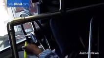 MTA bus driver caught driving with no hands while reading