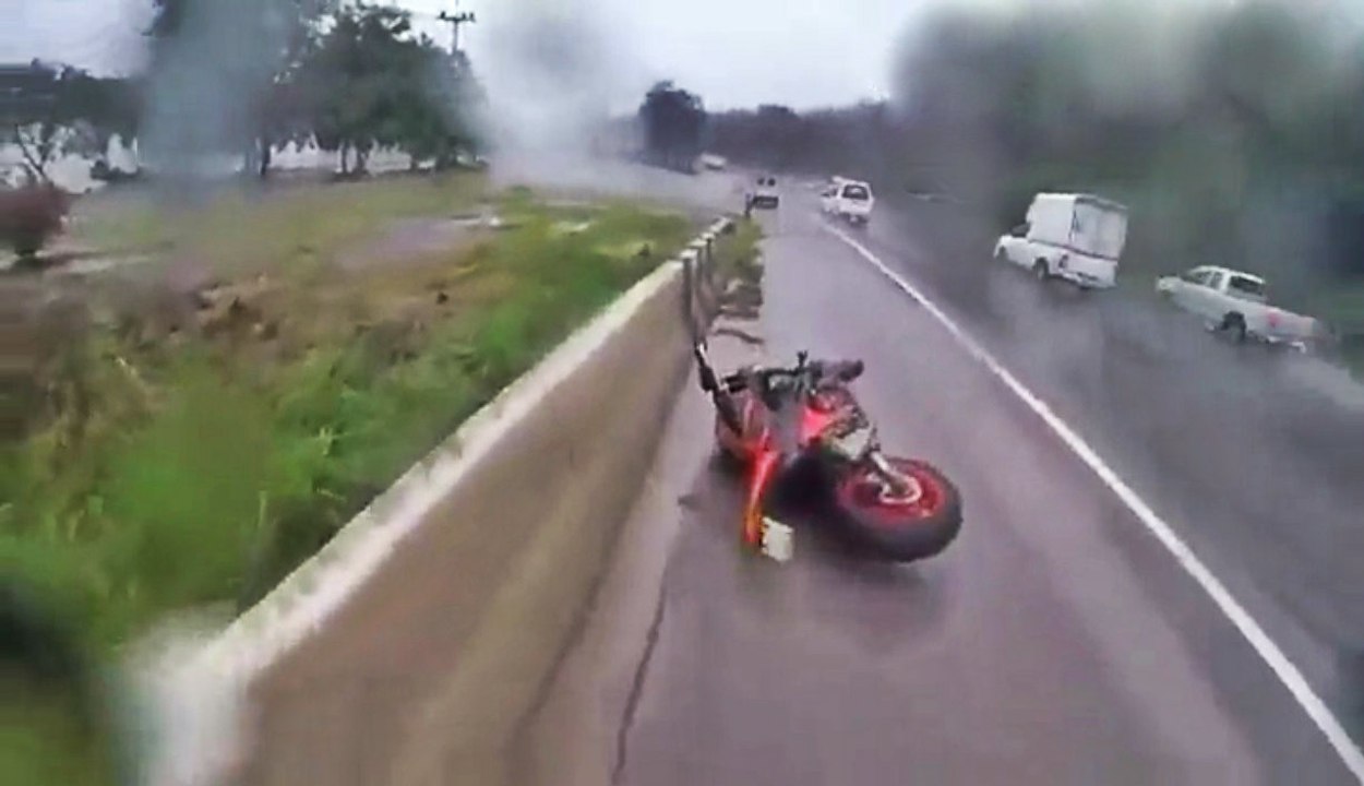 Biker Wipes Out But Keeps His Cool And Saves Girlfriend