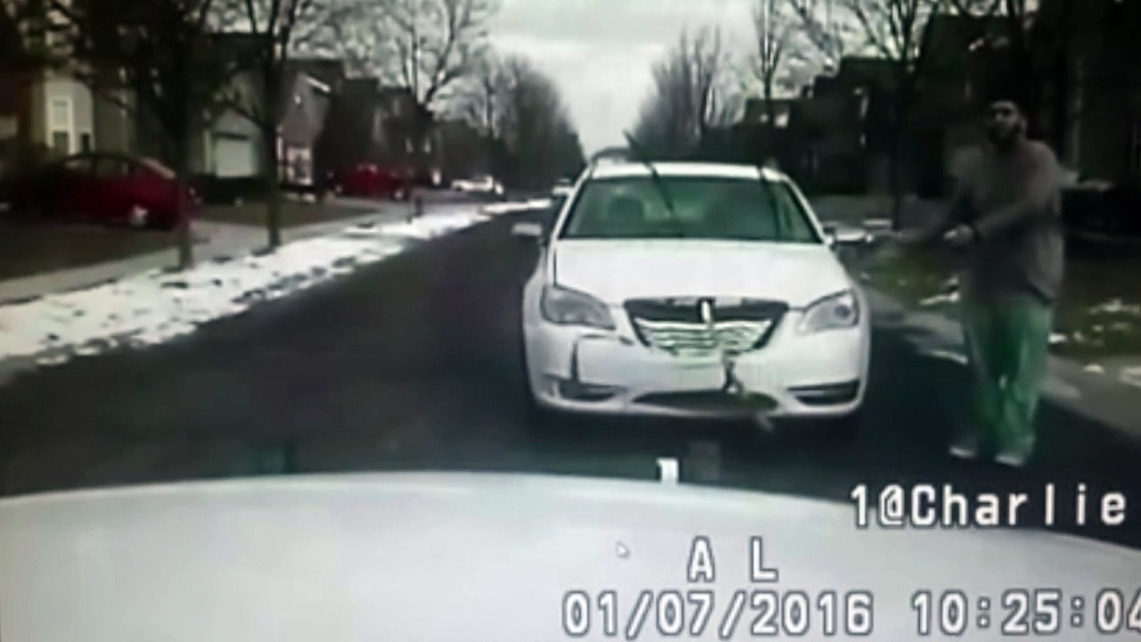 Michigan man flies off car roof in crash with police