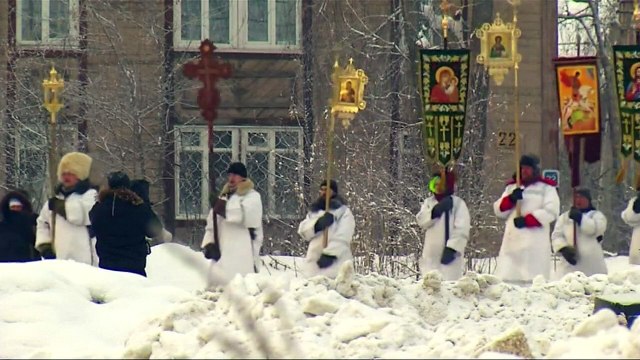 Russian Orthodox believers take icy plunge to mark Epiphany