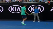 Jo-Wilfried Tsonga stops his Australian Open match to link arms with ball girl