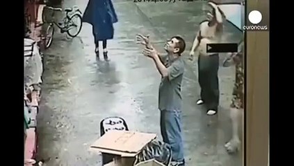 Two men catch a baby that fell out of a window..