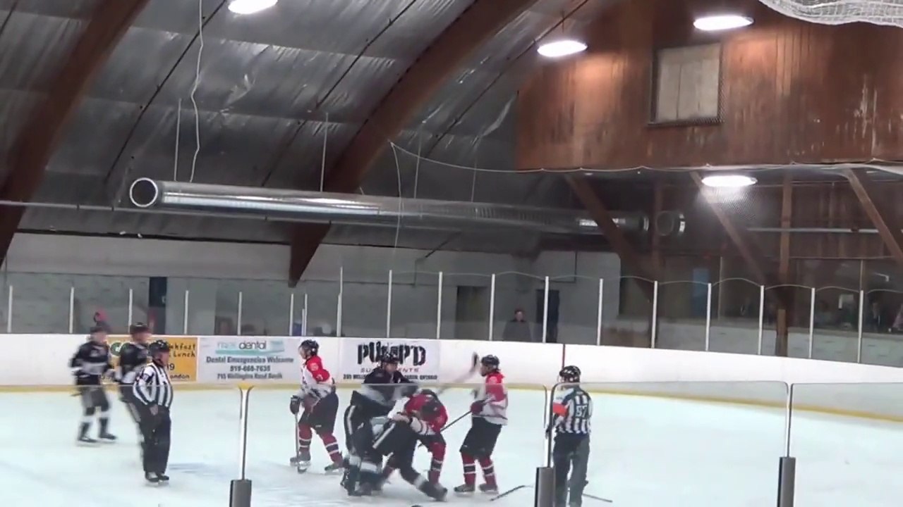 Hockey ref punches player!