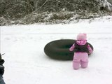 Dog Slides Across the Snow