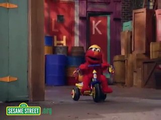 Sesame Street Elmo Riding A Tricycle