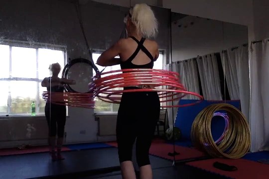 Girl Hula Hoops 7 Hoops at Once