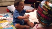 Cute Baby Laughing At Balloon His Mother Playing With For Him
