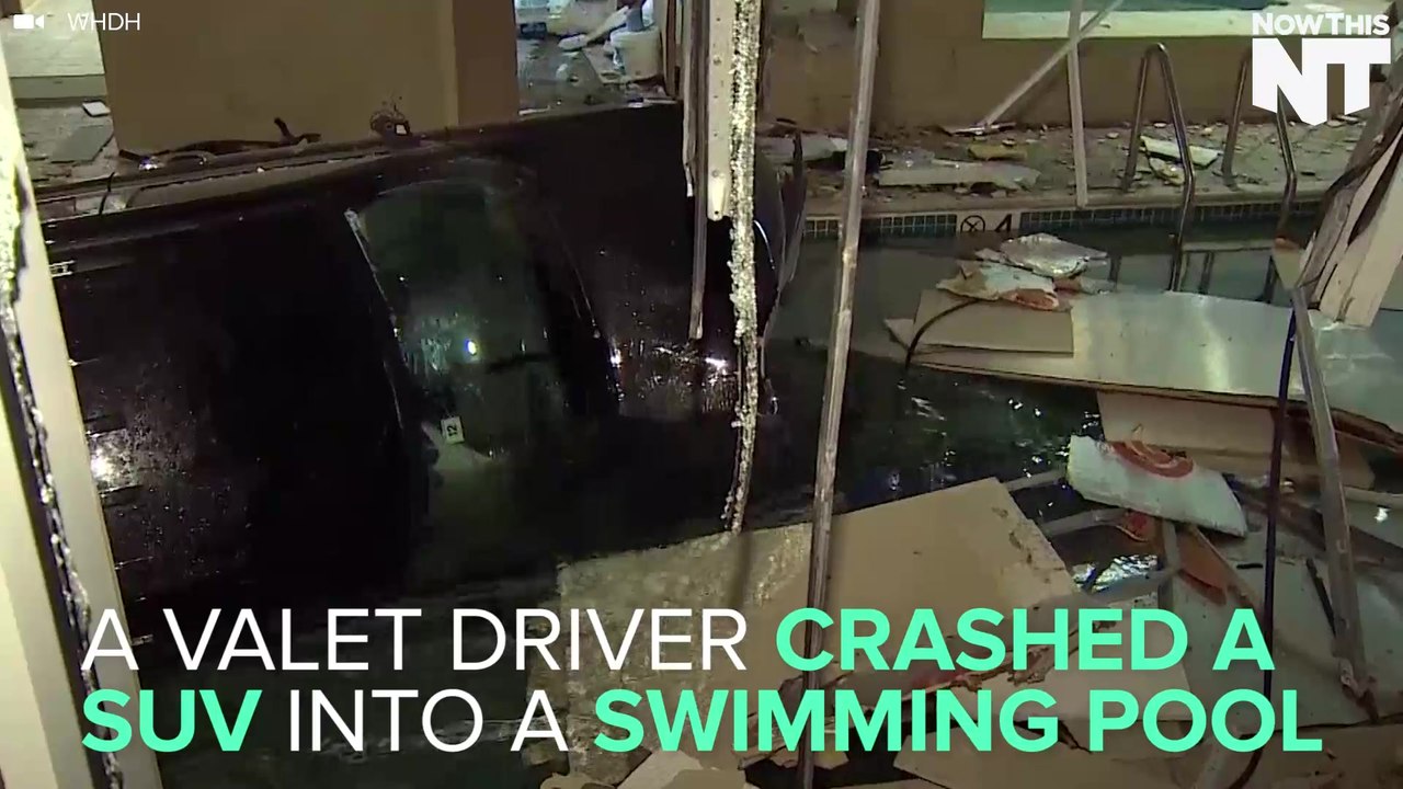 SUV Crashes Into Swimming Pool