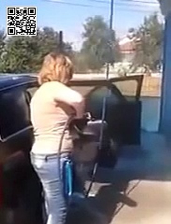 Dumb woman washing her car . inside