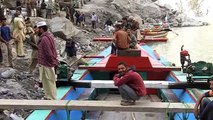 Crossing the Attabad Lake in Hunza, Pakistan.