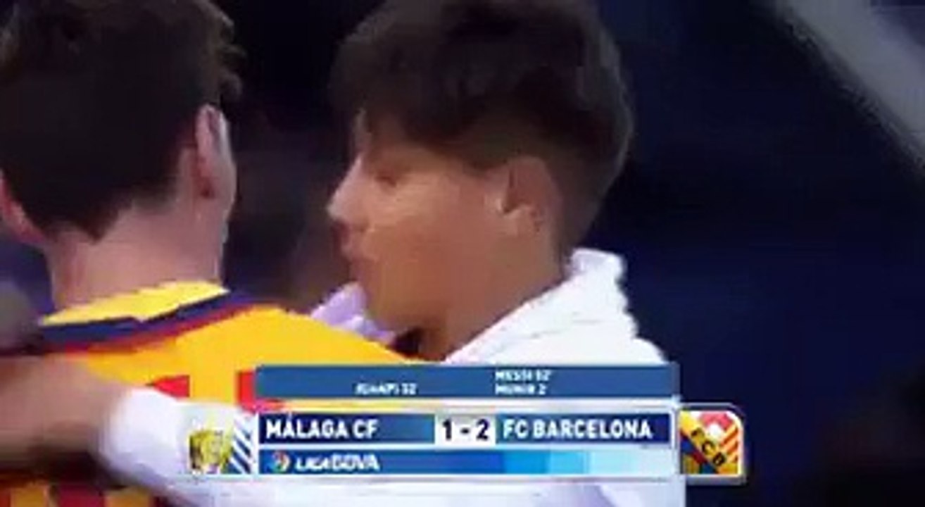 Messi gives a child his shirt.