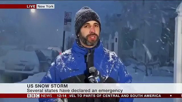 Blizzard 2016 is affecting New York, demonstrated by an umbrella and a rule