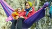 These adventurers “relax” in hammocks that hang hundreds of feet above ground...