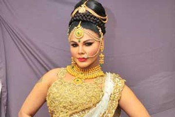 Rakhi Sawant parades for the photogs in bridal wear