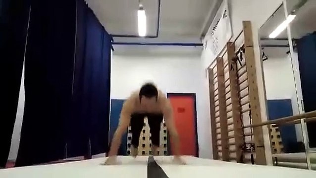 Man Performs Push Up and Handstand Variations