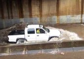Cars Drive Through Deep Floodwaters in Adelaide