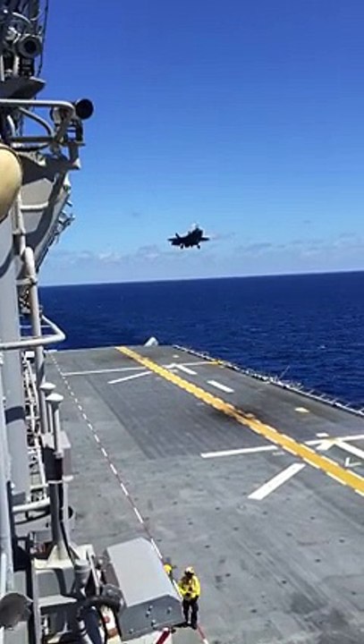 Fighting plane landing on ship