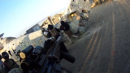 A teenager pulls in the back of a child with an Airsoft gun for no apparent reason.